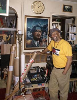 Artist Charles Lilly stands next to his famous painting of Malcolm X. The painting is featured on the Ballantine paperback edition of <em>The Autobiography of Malcolm X</em>. Artist Charles Lilly stands next to his famous painting of Malcolm X. The painting is featured on the Ballantine paperback edition of <em>The Autobiography of Malcolm X</em>.